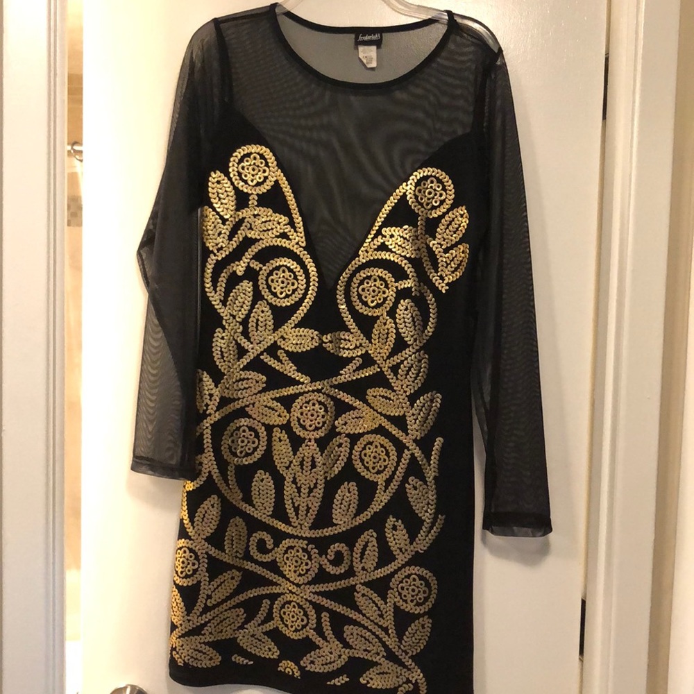 Exotic see through black and gold dress